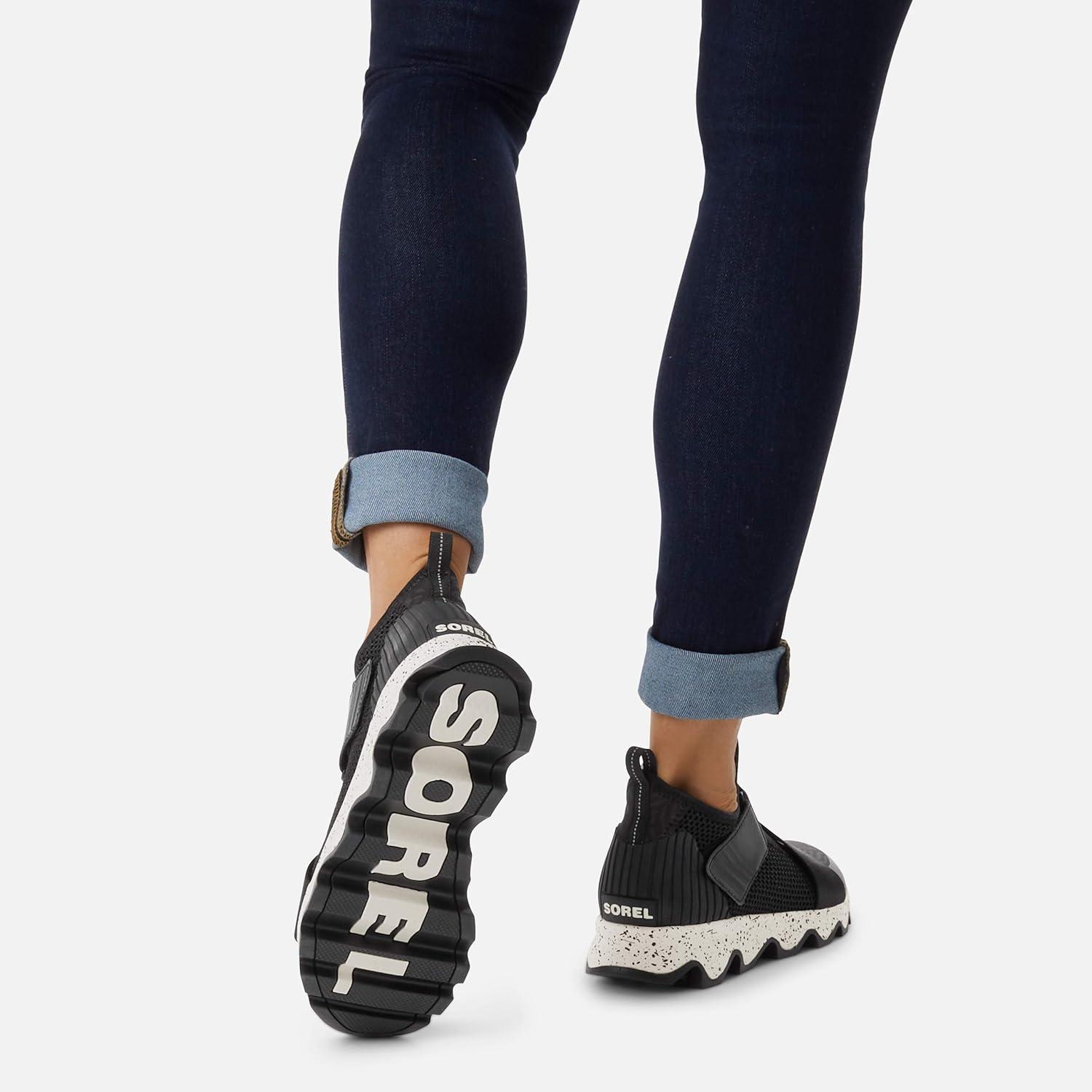 imageSOREL Womens Kinetic Sneak Knit Sneaker with Scalloped Sole and Stretch StrapsNordyblack Sea Salt